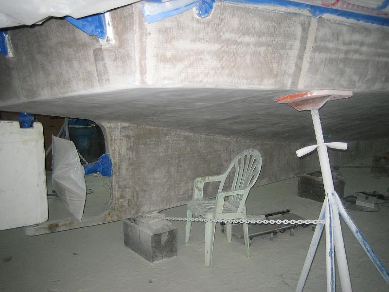 APRIL 22, 2009 002.jpg - Photo shows that they leave very little fairing material on the boat before painting.